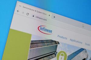 Homepage of infineon website on the display of PC, url - infineon.com. photo