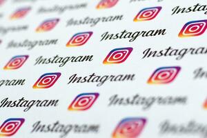 Instagram pattern printed on paper with small instagram logos and inscriptions. Instagram is American photo and video-sharing social networking service owned by Facebook