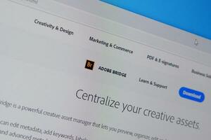 Web page of adobe bridge product on official website on the display of PC photo