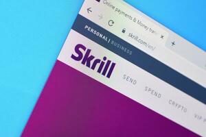 Homepage of skrill website on the display of PC, url - skrill.com. photo