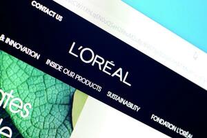 Homepage of loreal paris website on the display of PC, url - loreal.com. photo