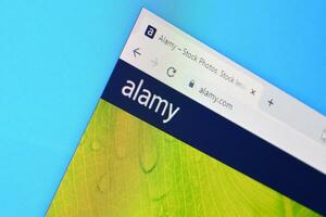 Homepage of alamy website on the display of PC, url - alamy.com. photo