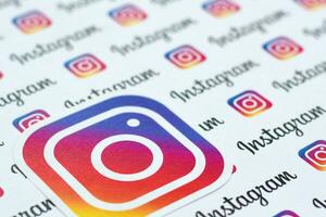 Instagram pattern printed on paper with small instagram logos and inscriptions. Instagram is American photo and video-sharing social networking service owned by Facebook