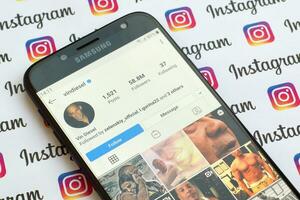 Vin Diesel official instagram account on smartphone screen on paper instagram banner. photo