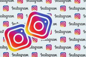 Instagram pattern printed on paper with small instagram logos and inscriptions. Instagram is American photo and video-sharing social networking service owned by Facebook