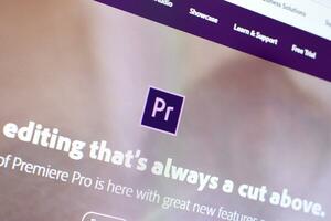 Web page of adobe premiere product on official website on the display of PC photo