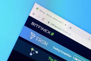 Homepage of bitfinex website on the display of PC, url - bitfinex.com. photo