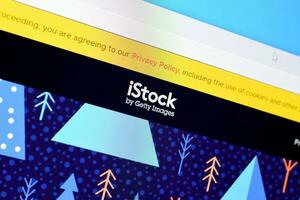 Homepage of istock website on the display of PC, url - istock.com. photo