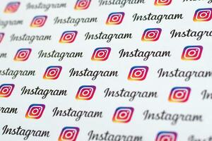 Instagram pattern printed on paper with small instagram logos and inscriptions. Instagram is American photo and video-sharing social networking service owned by Facebook