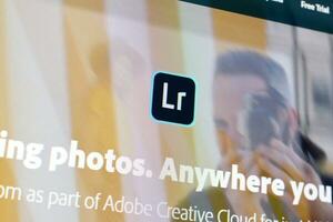 Web page of adobe lightroom product on official website on the display of PC photo