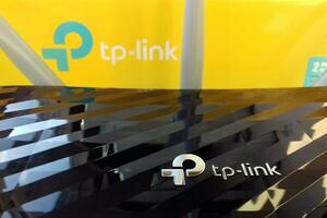 Wireless router modem tp link Archer C20 AC750 and colored cardboard box with tp-link logo photo