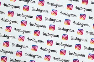 Instagram pattern printed on paper with small instagram logos and inscriptions. Instagram is American photo and video-sharing social networking service owned by Facebook