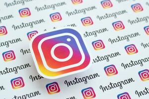 Instagram pattern printed on paper with small instagram logos and inscriptions. Instagram is American photo and video-sharing social networking service owned by Facebook