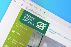 Homepage of credit-agricole website on the display of PC, url - credit-agricole.com. photo