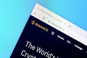 Homepage of binance website on the display of PC, url - binance.com. photo