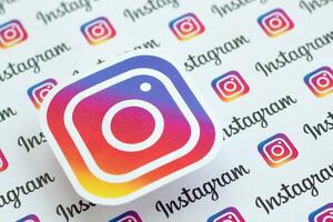 Instagram pattern printed on paper with small instagram logos and inscriptions. Instagram is American photo and video-sharing social networking service owned by Facebook