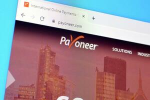 Homepage of payoneer website on the display of PC, url - payoneer.com. photo