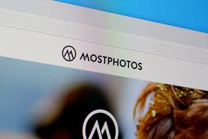 Homepage of mostphotos website on the display of PC, url - mostphotos.com. photo