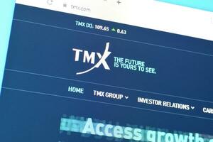 Homepage of tmx website on the display of PC, url - tmx.com. photo