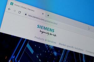 Homepage of siemens website on the display of PC, url - siemens.com. photo