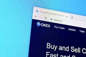 Homepage of okex website on the display of PC, url - okex.com. photo
