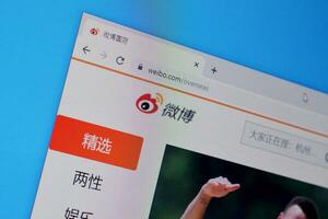 Homepage of weibo website on the display of PC, url - weibo.com. photo