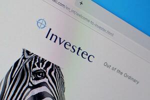 Homepage of investec website on the display of PC, url - investec.com. photo