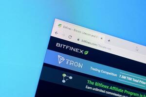 Homepage of bitfinex website on the display of PC, url - bitfinex.com. photo