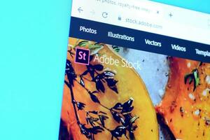 Homepage of adobe stock website on the display of PC, url - stock.adobe.com. photo