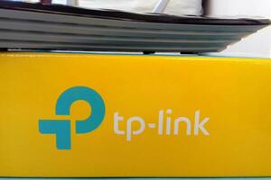 Wireless router modem tp link Archer C20 AC750 and colored cardboard box with tp-link logo photo