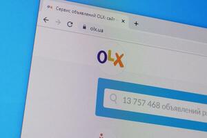 Homepage of olx website on the display of PC, url - olx.ua. photo