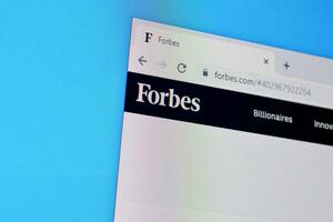 Homepage of forbes website on the display of PC, url - forbes.com. photo