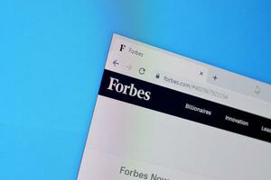 Homepage of forbes website on the display of PC, url - forbes.com. photo