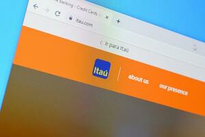 Homepage of itau website on the display of PC, url - itau.com. photo