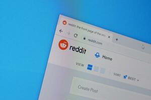 Homepage of reddit website on the display of PC, url - reddit.com. photo