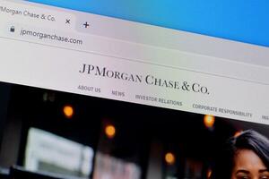 Homepage of jp morgan chase website on the display of PC, url - jpmorganchase.com. photo