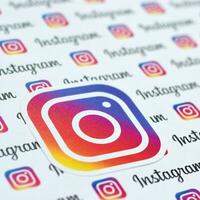 Instagram pattern printed on paper with small instagram logos and inscriptions. Instagram is American photo and video-sharing social networking service owned by Facebook