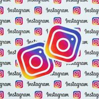 Instagram pattern printed on paper with small instagram logos and inscriptions. Instagram is American photo and video-sharing social networking service owned by Facebook