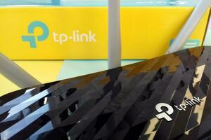 Wireless router modem tp link Archer C20 AC750 and colored cardboard box with tp-link logo photo