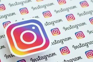 Instagram pattern printed on paper with small instagram logos and inscriptions. Instagram is American photo and video-sharing social networking service owned by Facebook