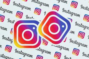 Instagram pattern printed on paper with small instagram logos and inscriptions. Instagram is American photo and video-sharing social networking service owned by Facebook