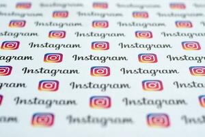 Instagram pattern printed on paper with small instagram logos and inscriptions. Instagram is American photo and video-sharing social networking service owned by Facebook