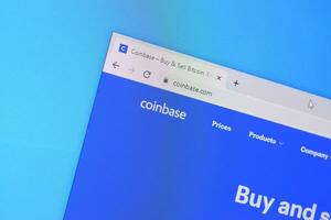 Homepage of coinbase website on the display of PC, url - coinbase.com. photo