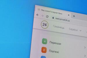 Homepage of privat24 website on the display of PC, url - next.privat24.ua. photo