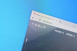 Homepage of tesla website on the display of PC, url - tesla.com. photo