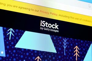 Homepage of istock website on the display of PC, url - istock.com. photo