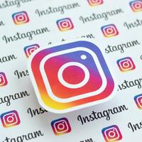 Instagram pattern printed on paper with small instagram logos and inscriptions. Instagram is American photo and video-sharing social networking service owned by Facebook