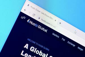 Homepage of huobi website on the display of PC, url - huobi.com. photo