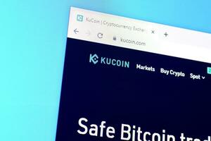 Homepage of kucoin website on the display of PC, url - kucoin.com. photo