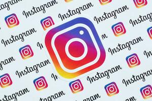 Instagram pattern printed on paper with small instagram logos and inscriptions. Instagram is American photo and video-sharing social networking service owned by Facebook